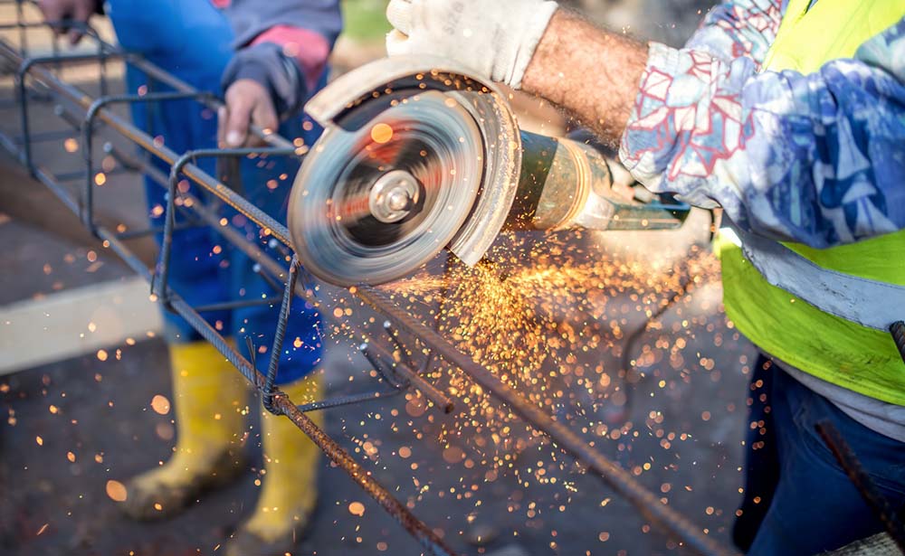 electrical worker cutting metal
