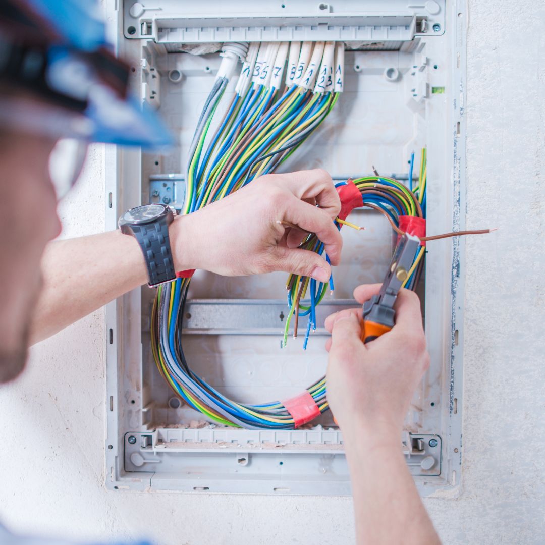 Electrician inspecting box