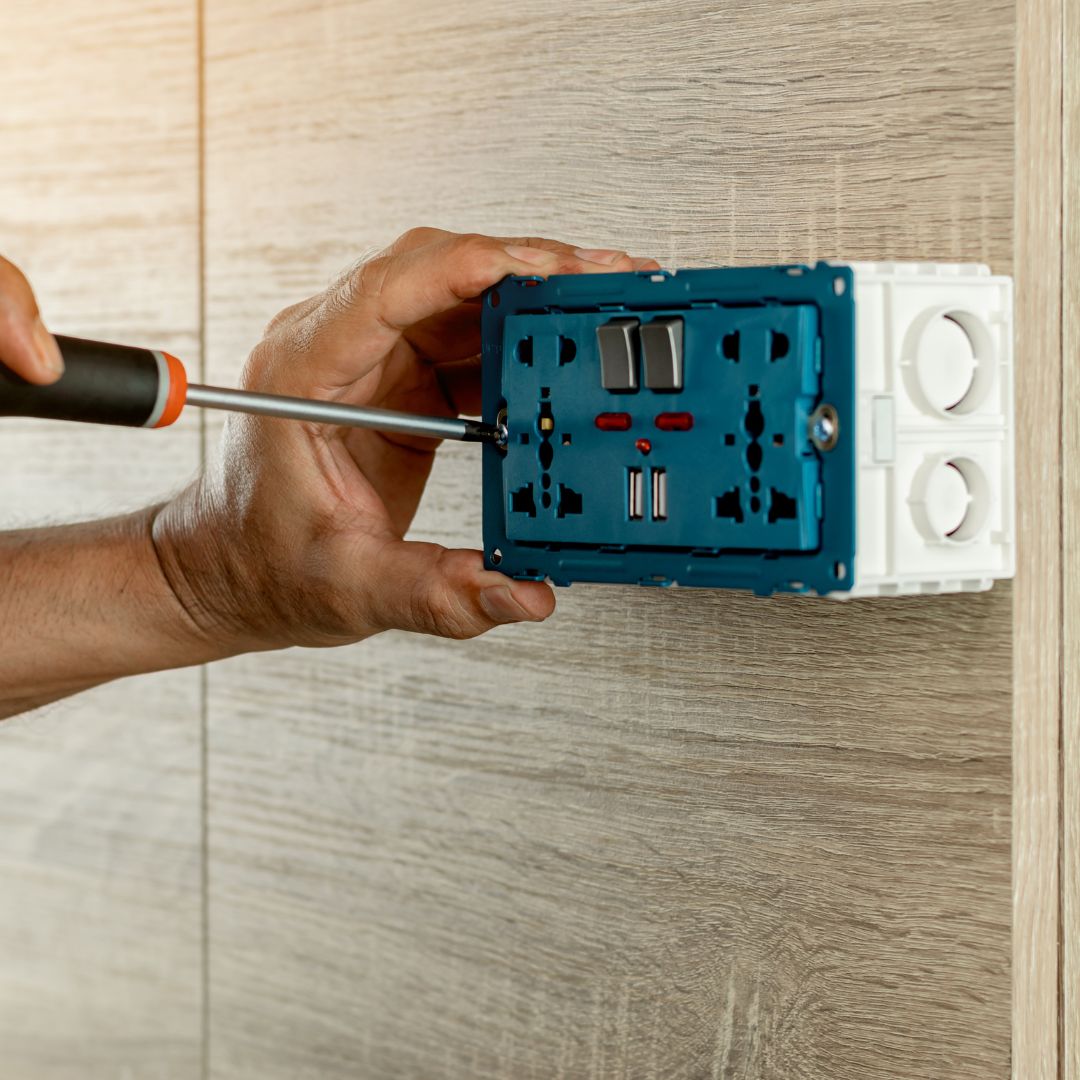 person working on an outlet