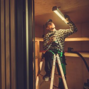 man putting up an LED light