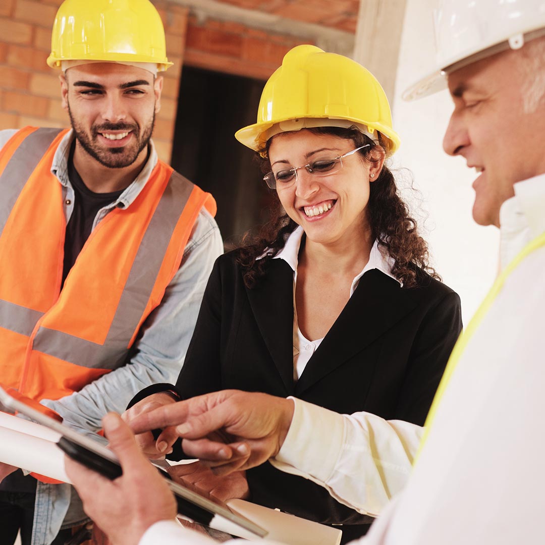 construction workers consulting with an electrician