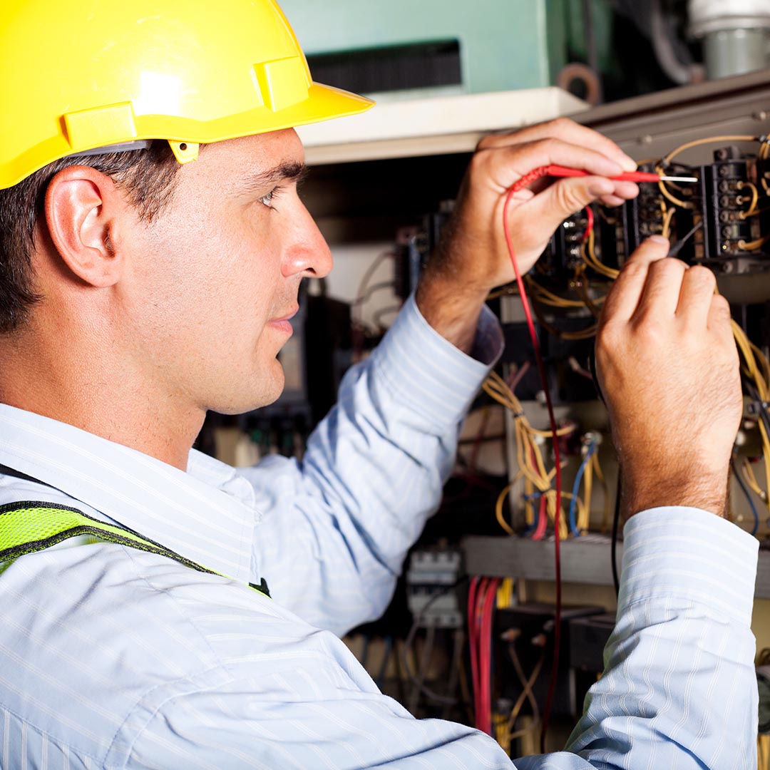 electrician working on a commercial electrical panel