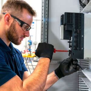 Electrician working on electrical panel