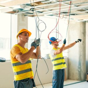 Happy electricians working
