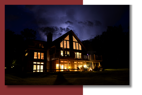 home with lights on during storm
