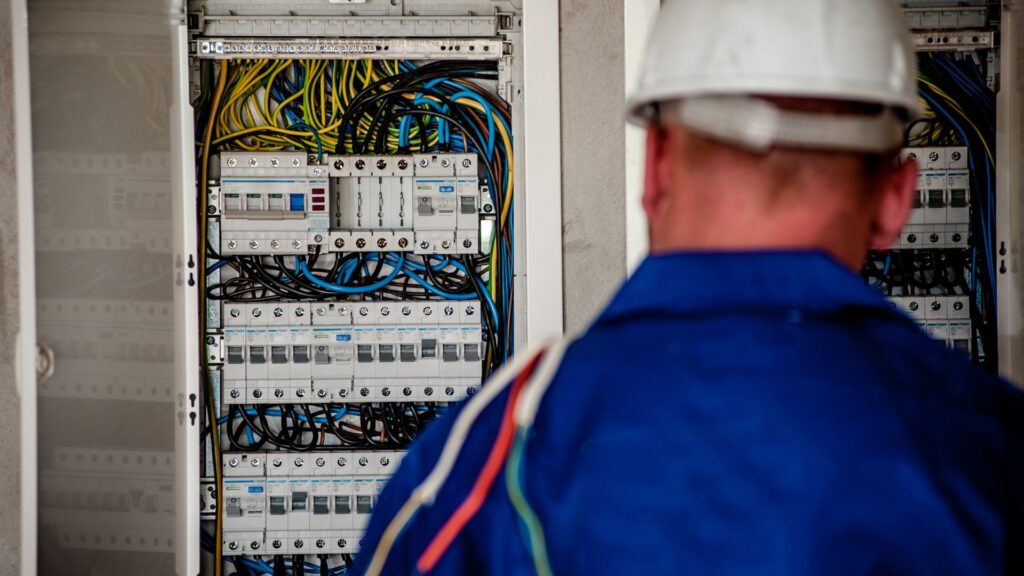 electrician checking electrical panel