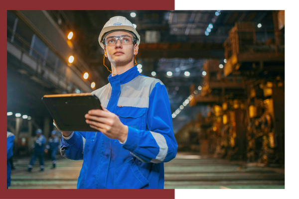 electrician standing in manufacturing facility